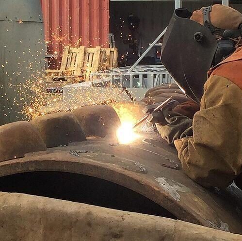 Welder fabricating a boiler drum at Continental Boilers' Lahore workshop